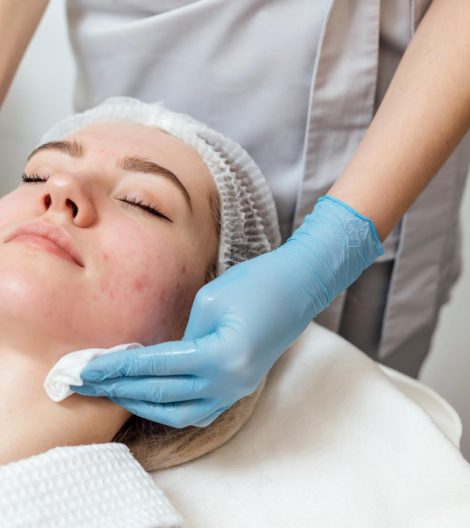 beautician-cleanse-moisturize-face-young-female