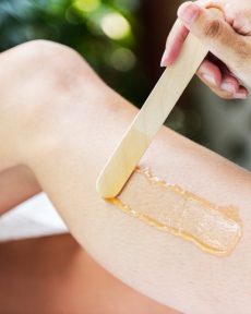 woman-getting-legs-waxed-spa
